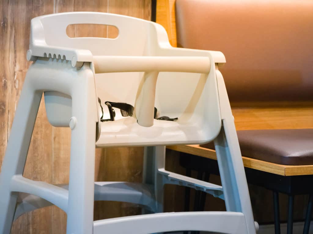 high chair seat for sit eating position for kids in fast food.use baby chair seat for safe cute child in cafe breakfast.high chair seat have guard for protect baby sitting.high chair seat position.